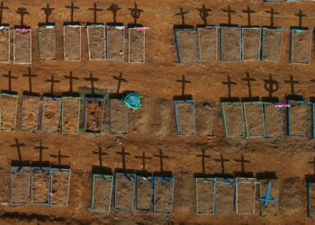 An aerial view of crosses casting shadows at the Parque Taruma cemetery, amid the coronavirus disease (COVID-19) outbreak, in Manaus, Brazil, June 15, 2020. Picture taken with a drone. REUTERS/Bruno Kelly - RC2S9H9D3KH3