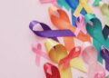 colorful ribbons on pink background, cancer awareness, World cancer day